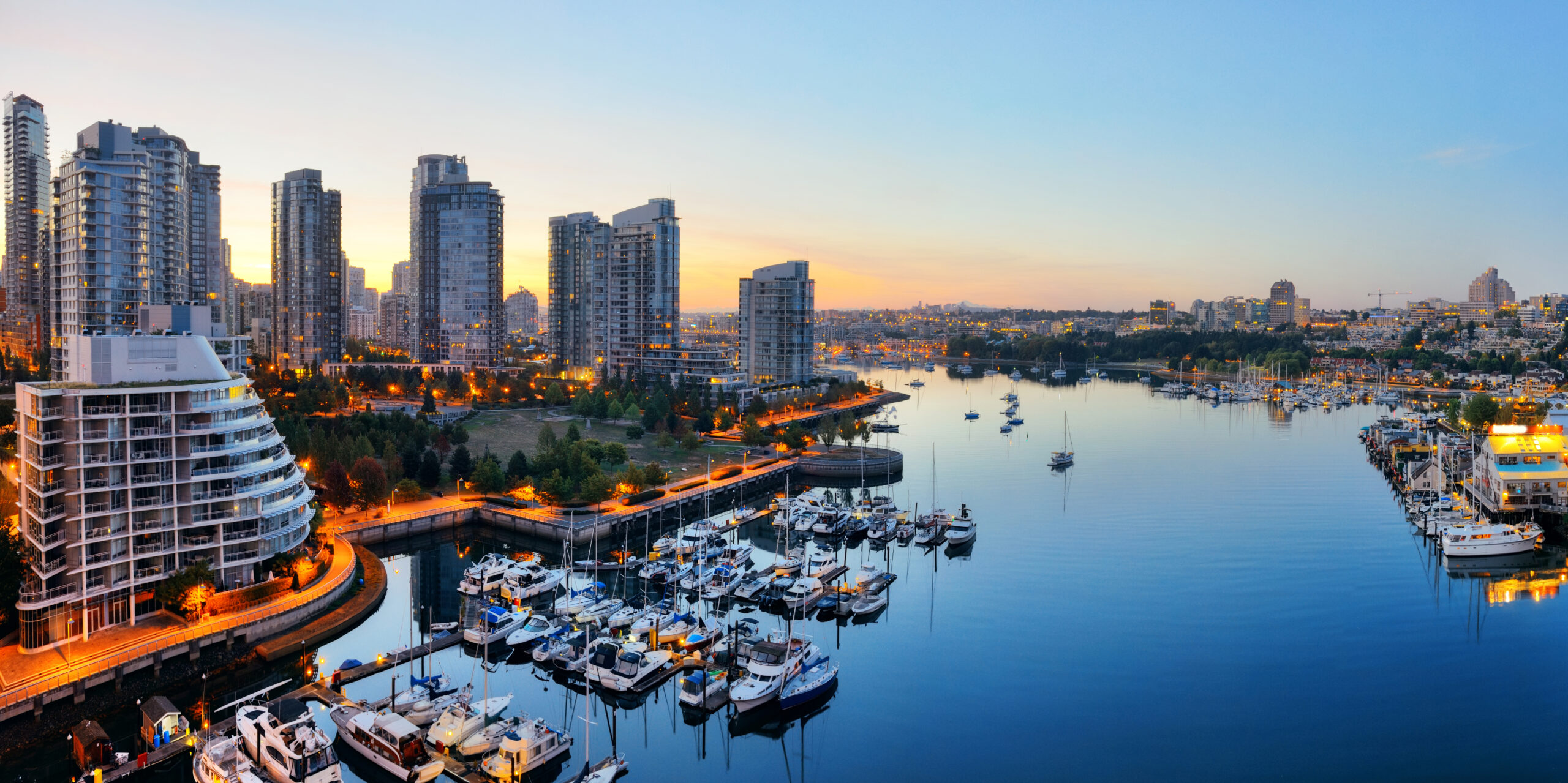 Vancouver harbor view Vancouver harbor view with urban apartment buildings and bay boat in Canada.
